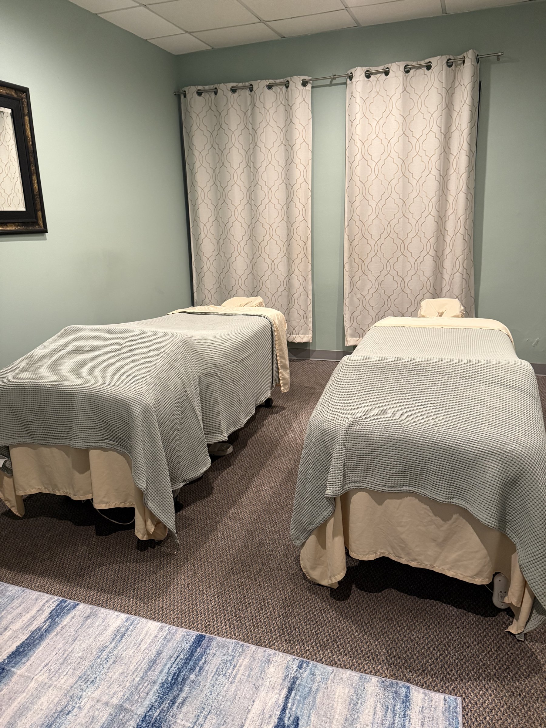 Couples massage room with two tables side by side