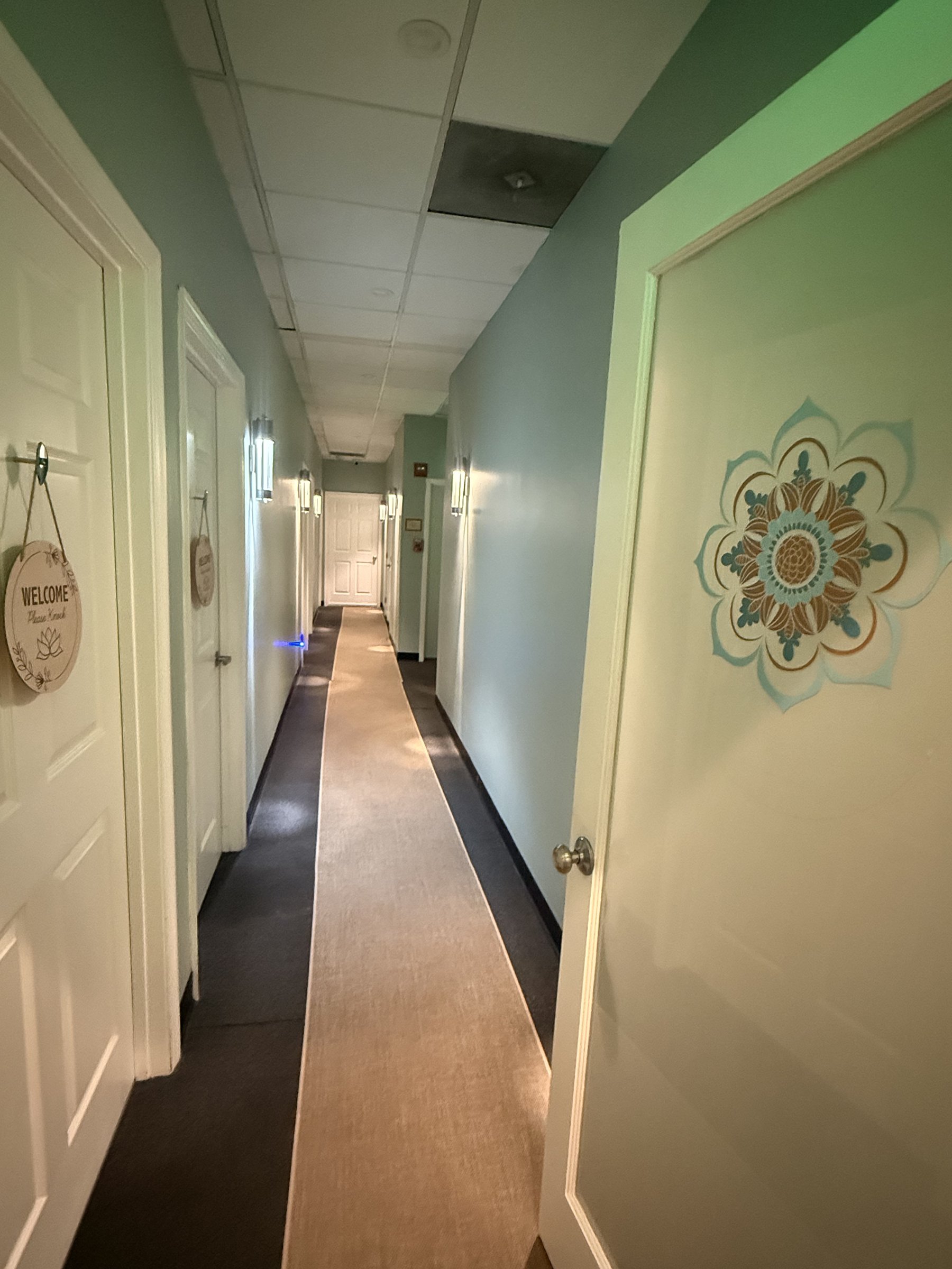 Treatment room door painted with the Spa Flow Studio mandala